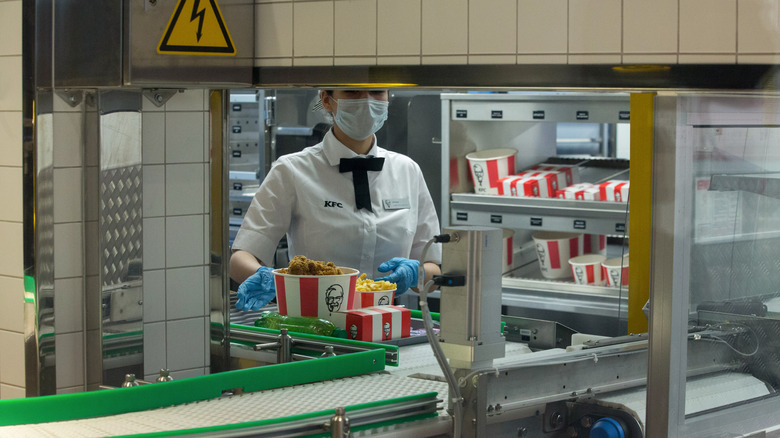 KFC employee serving chicken