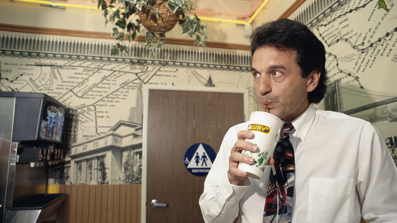 Subway founder drinking from cup