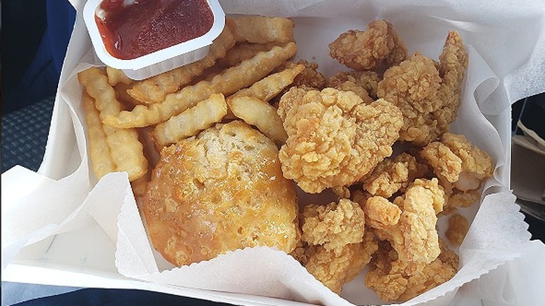 Breaded shrimp with fries and biscuit