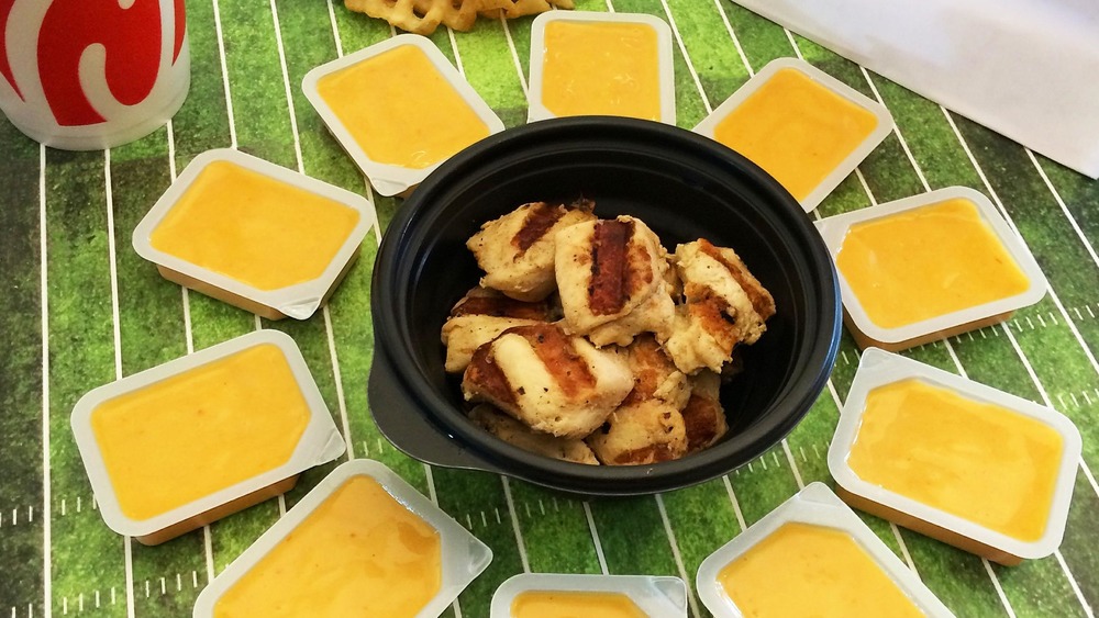 Chick-fil-A sauce around grilled chicken nuggets