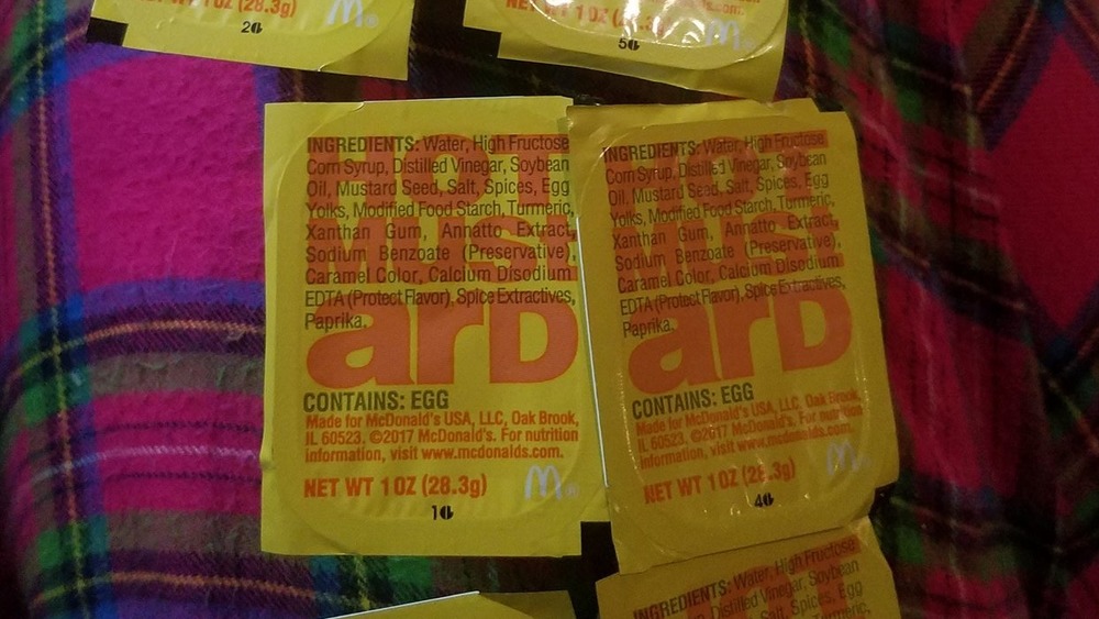 Line up of McDonald's hot mustard packets