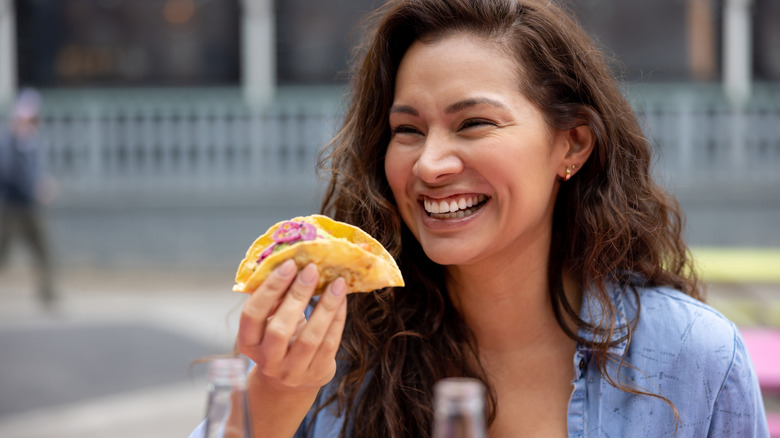 happy woman with taco