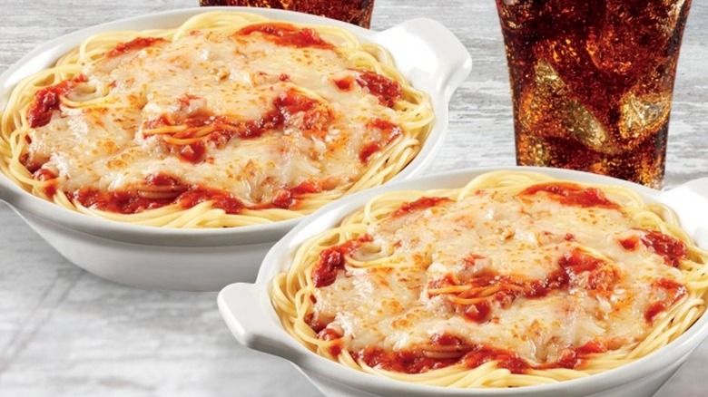 bowls of pasta with melted cheese