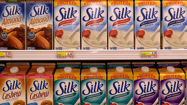 Cartons of Silk milks in store case. 