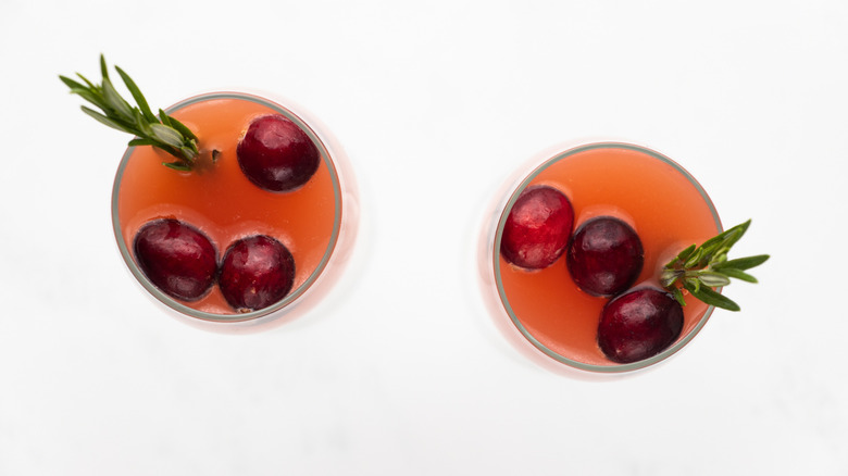 Two cranberry mimosa cocktails