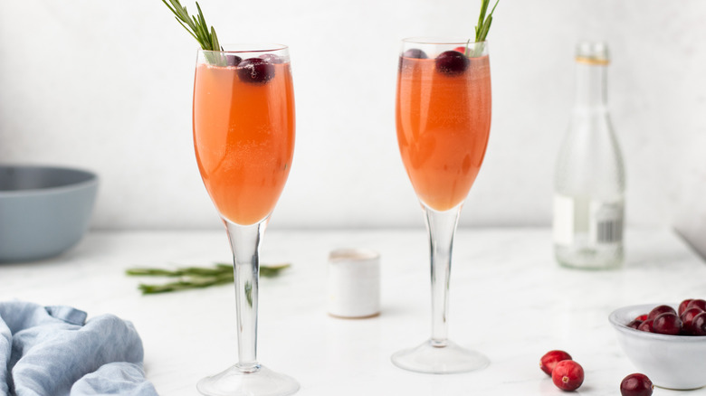 Two cranberry mimosa cocktails