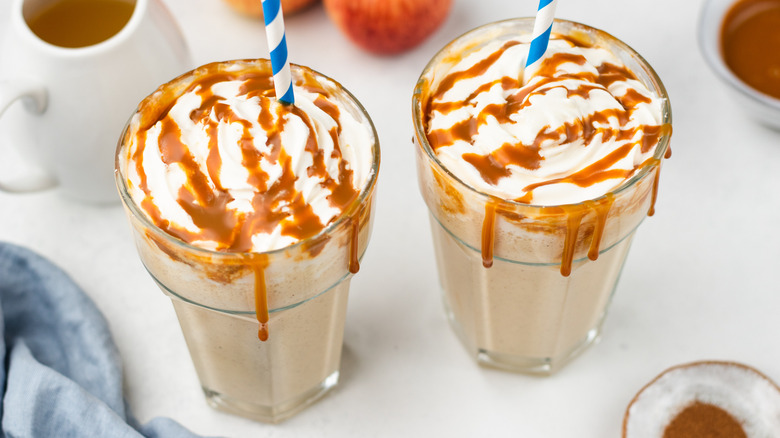 two caramel apple milkshakes