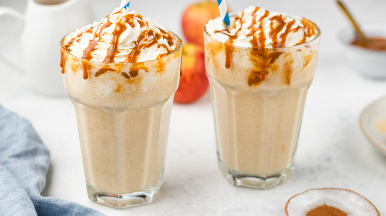 two caramel apple milkshakes