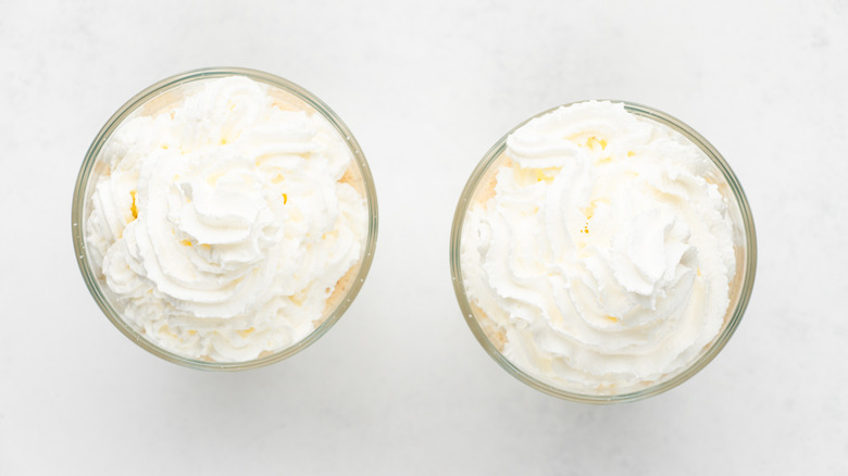 two milkshakes with whipped cream