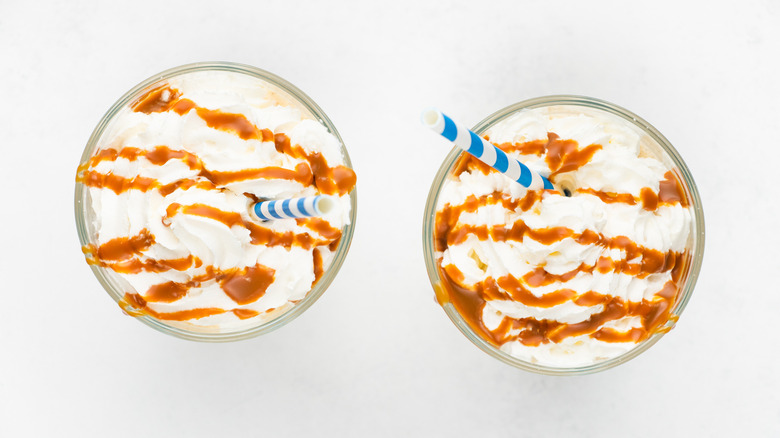 two milkshakes with caramel drizzle