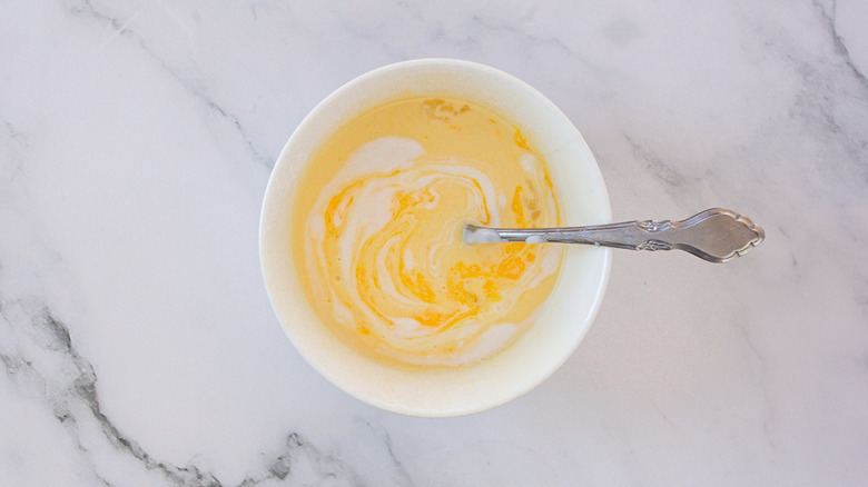 small bowl of custard with knife