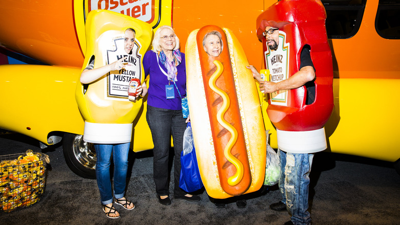 Wienermobile with costumed attendants