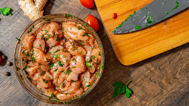 marinating chicken in bowl