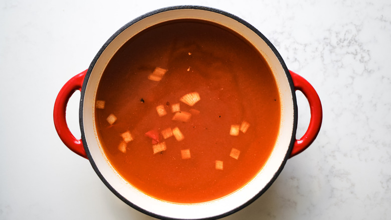 crushed tomatoes broth in pot