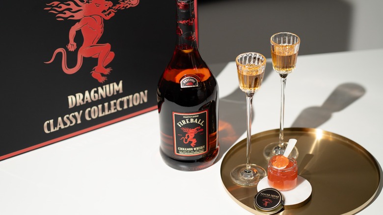 Fireball Whisky flute glasses, champagne bottle and caviar