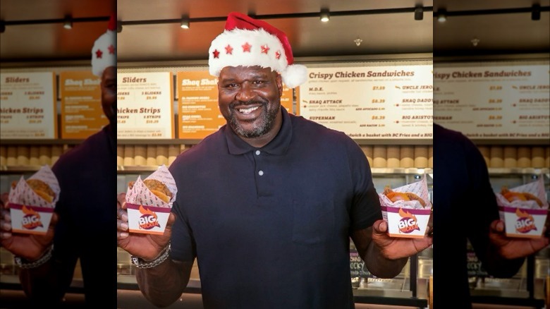 shaquille o'neal holding chicken sandwiches