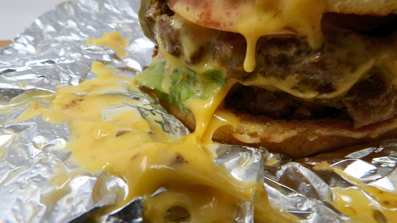 Closeup of cheesy Five Guys cheeseburger