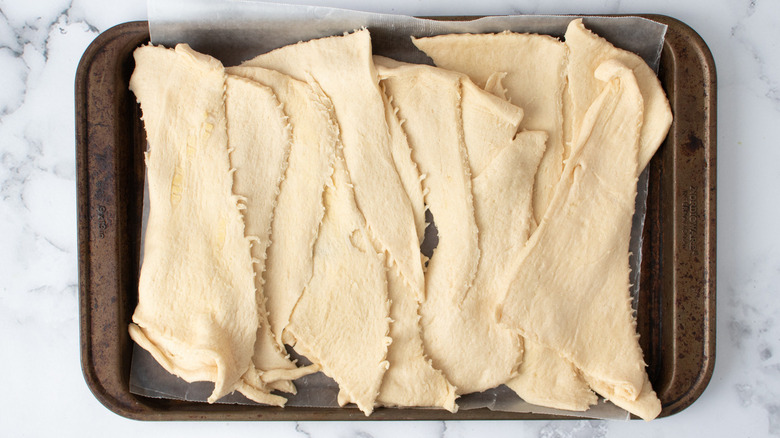 raw dough strips in pan
