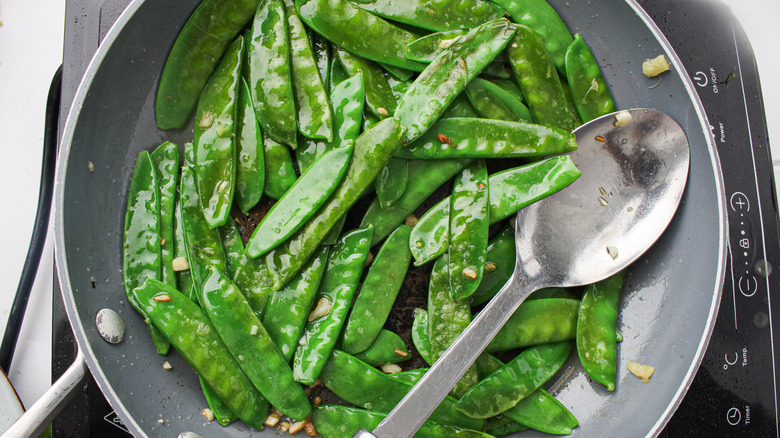 snow peas in a pan