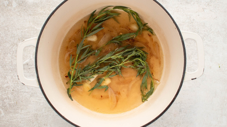 tarragon broth in white pot