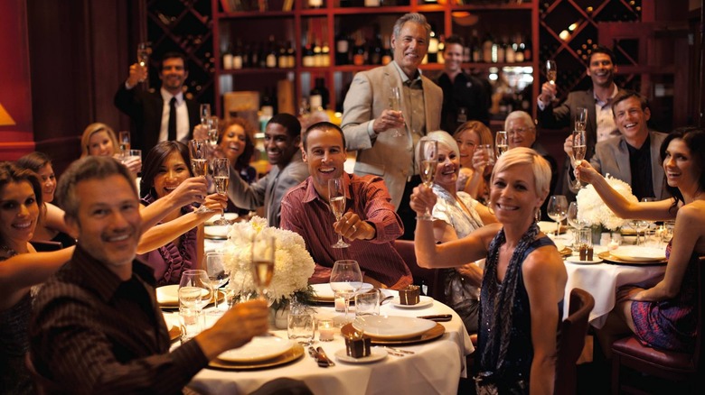 party guests toasting at fleming's