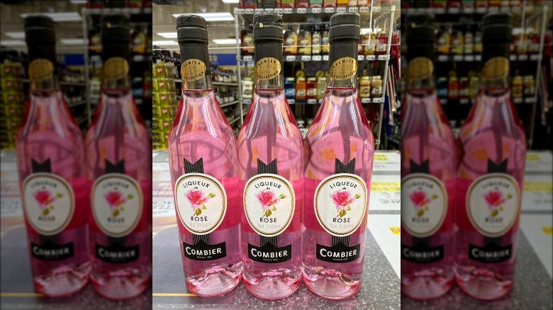 Combier Rose Liqueur bottles in a store