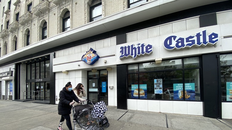 People walking by a White Castle