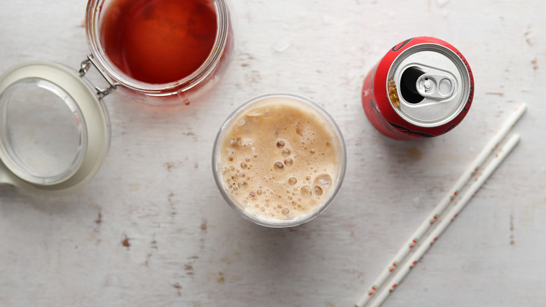 soda and cherry syrup in a glass