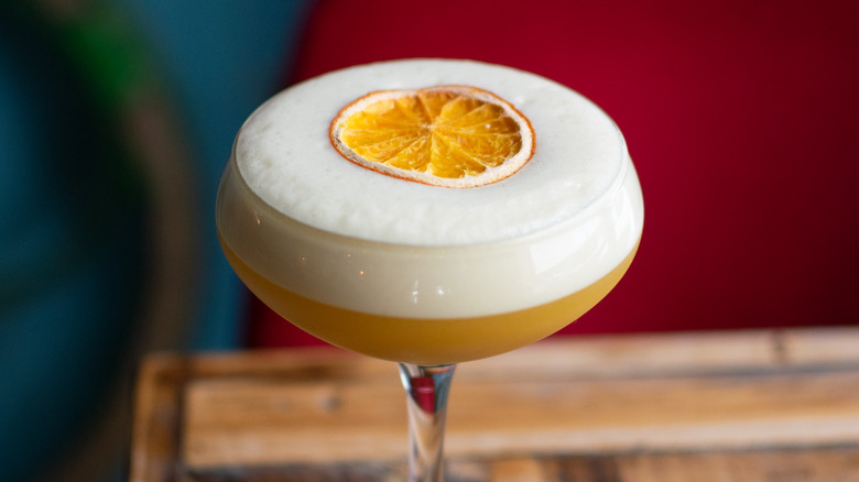 orange cocktail with foam 