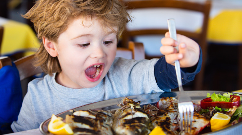 Child eating at restaurant