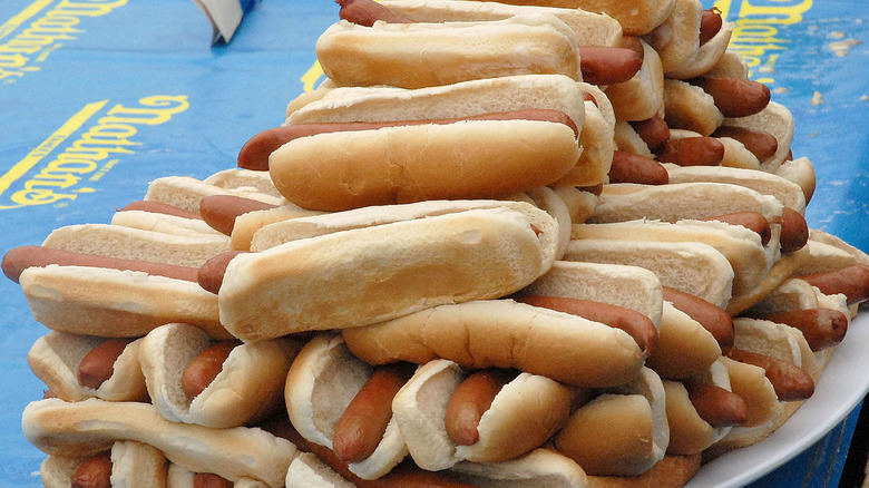 Pile of hot dogs on table