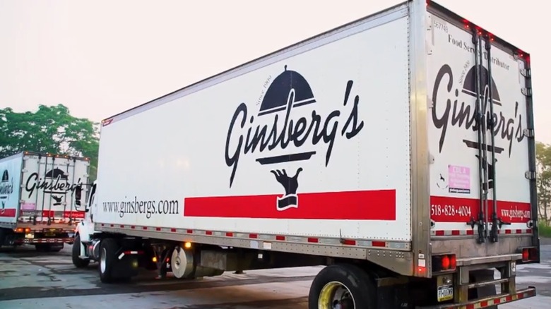 Ginsberg's Foods delivery truck is in a parking lot