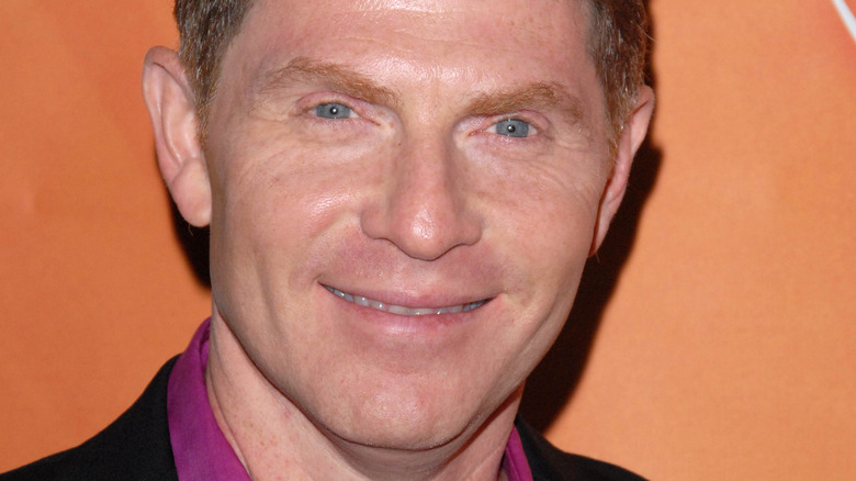 Bobby Flay against orange background