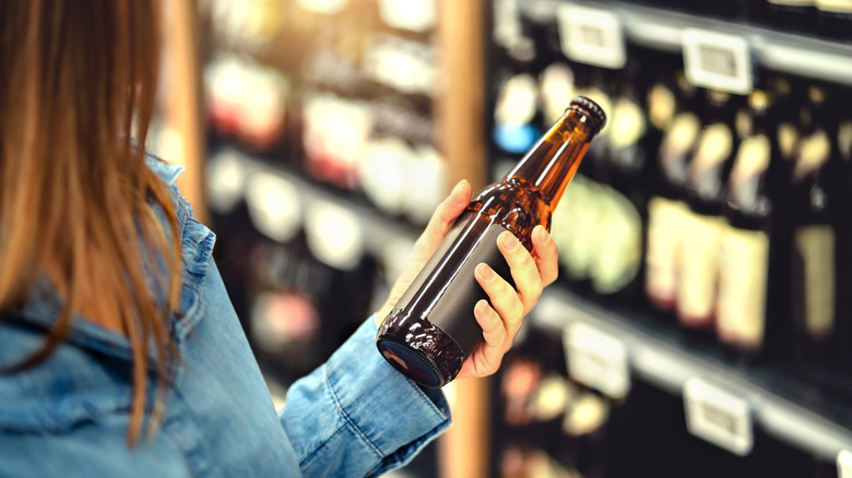 woman buying craft beers