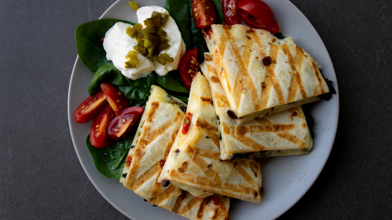 Quesadilla with tomato, sour cream, lettuce