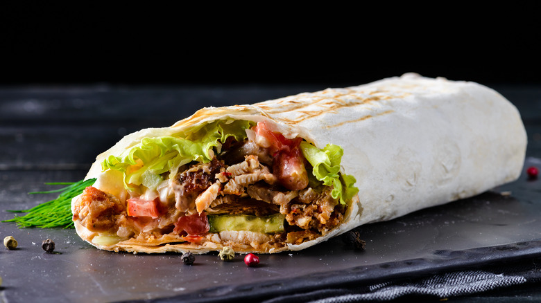 Burrito with meat, tomato, lettuce