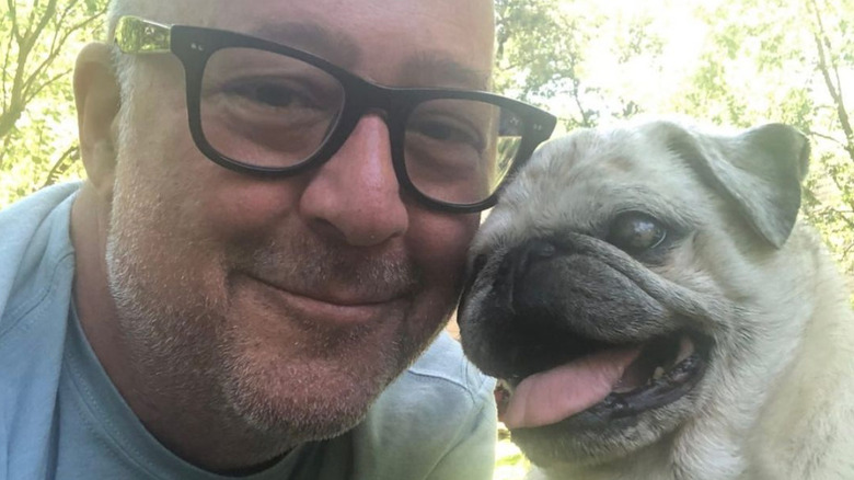 Andrew Zimmern with pug, Pretzel