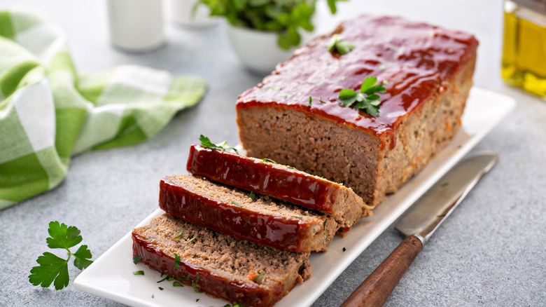 Sliced meatloaf on a white plate