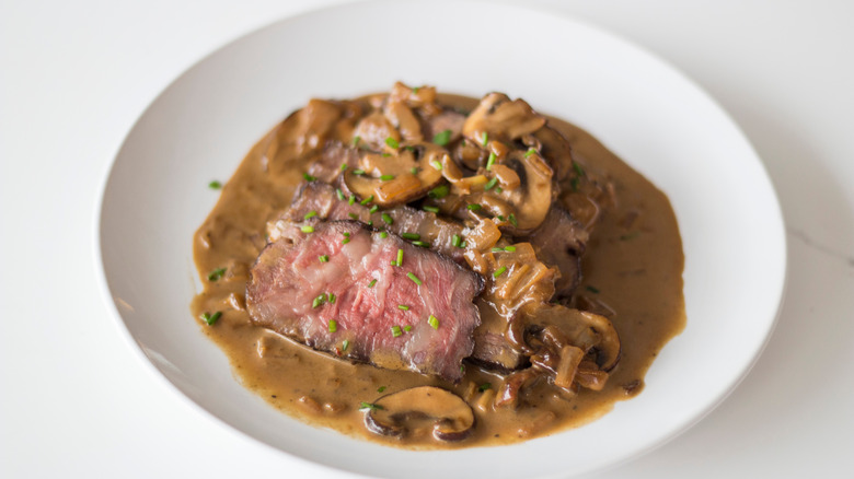 Steak Diane on a white plate