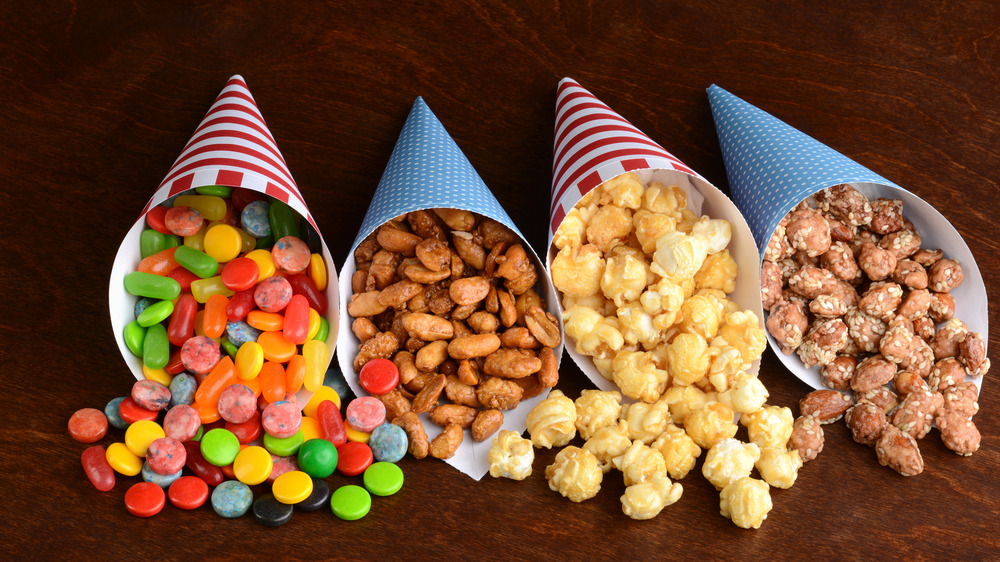 flavored popcorn, candy and nut mixes in party cones