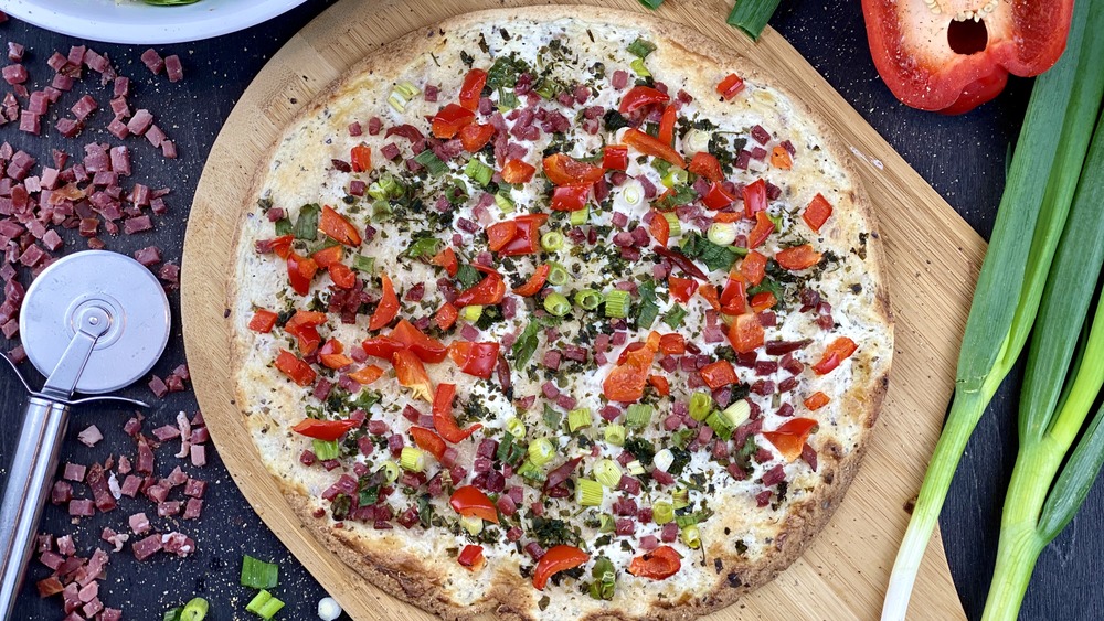Pizza with meat and vegetable toppings