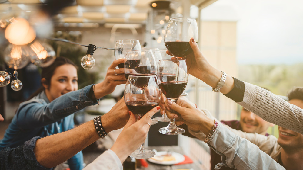 Diners drinking wine at restaurant