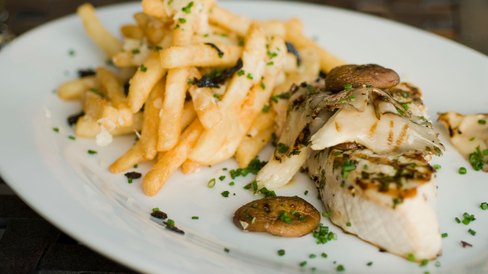 swordfish on a plate with fries