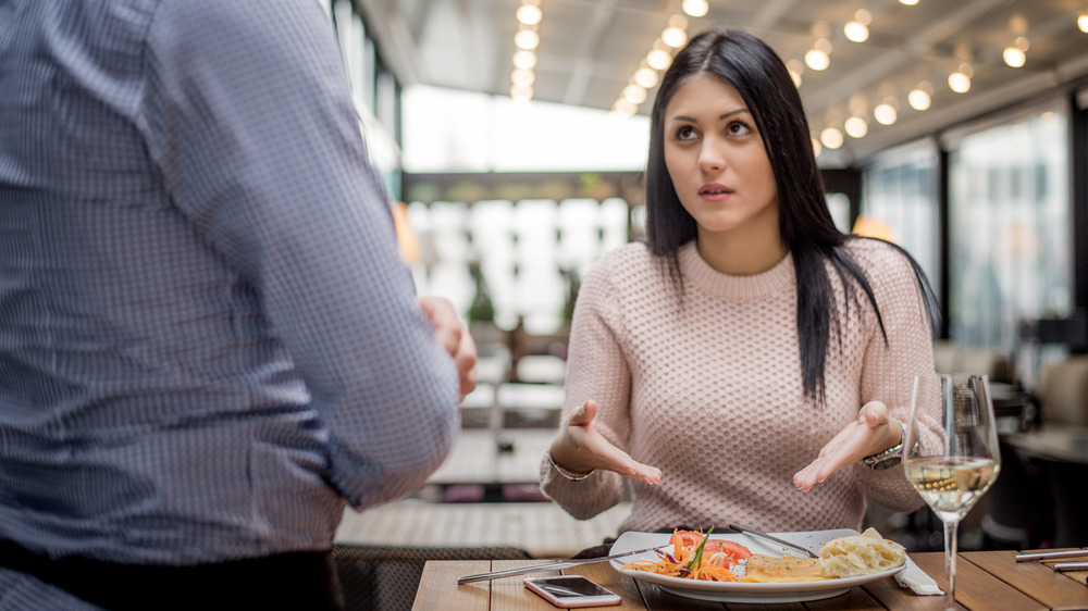 woman complaining about food in restaurant