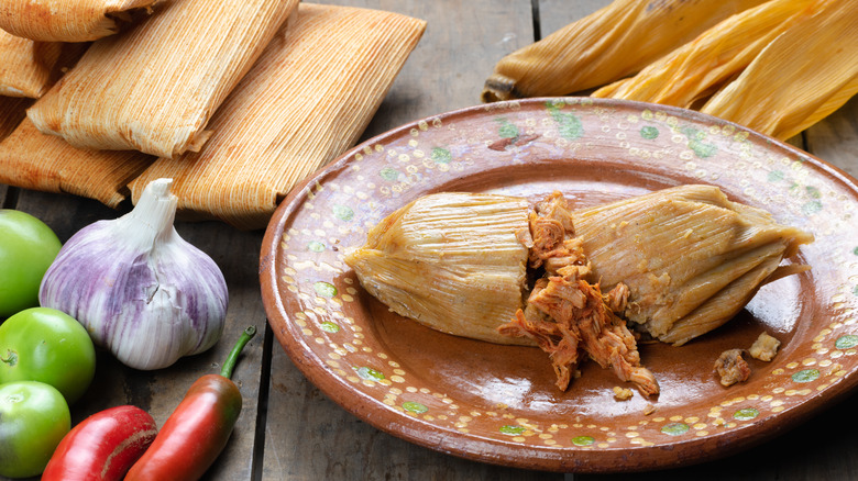 split open tamale on plate