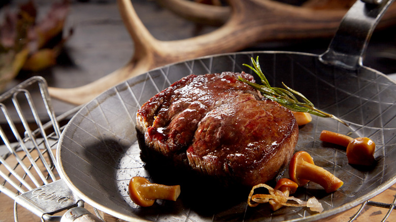 venison searing in pan