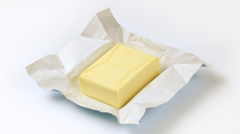 Butter in an open foil wrapper