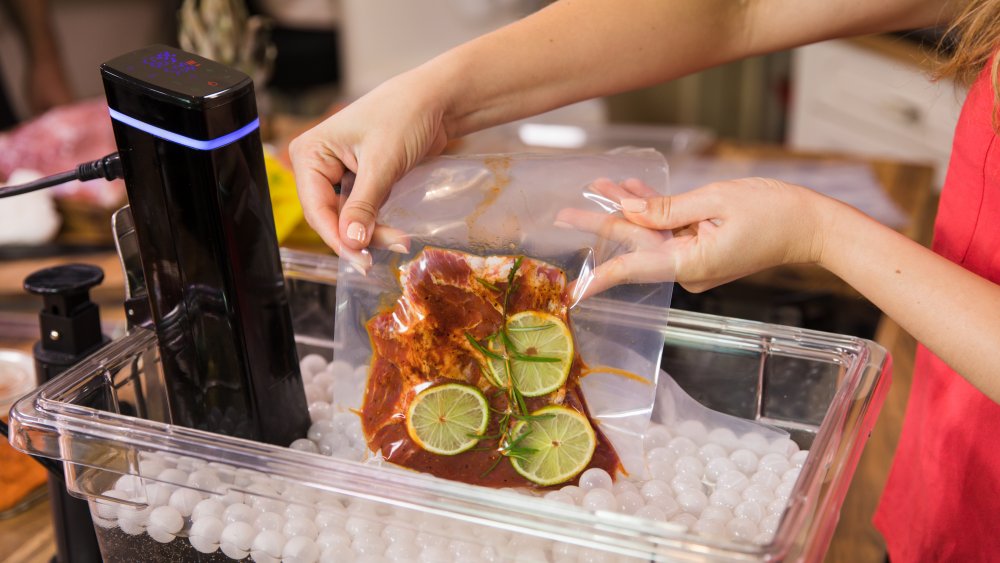 woman cooking with sous vide