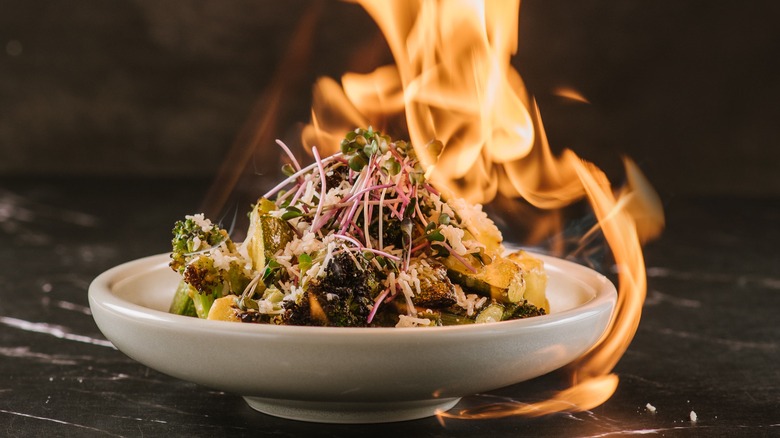 Plate of vegetables on fire