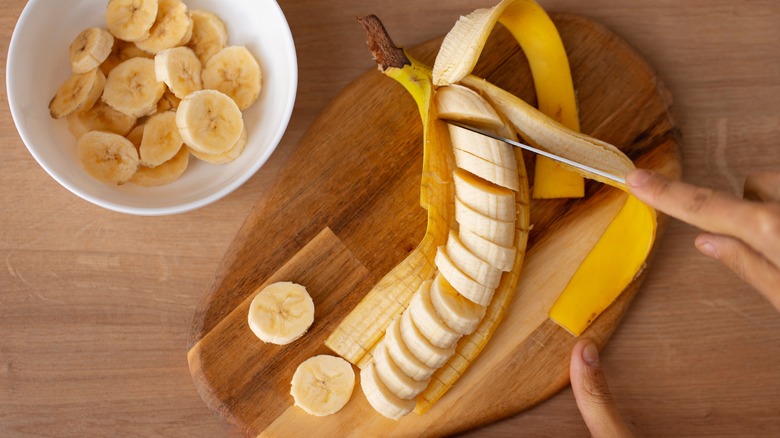 sliced banana on cutting board